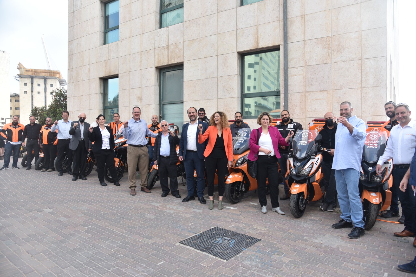 Director Generals hand keys to new ambucycles to EMT volunteers 1