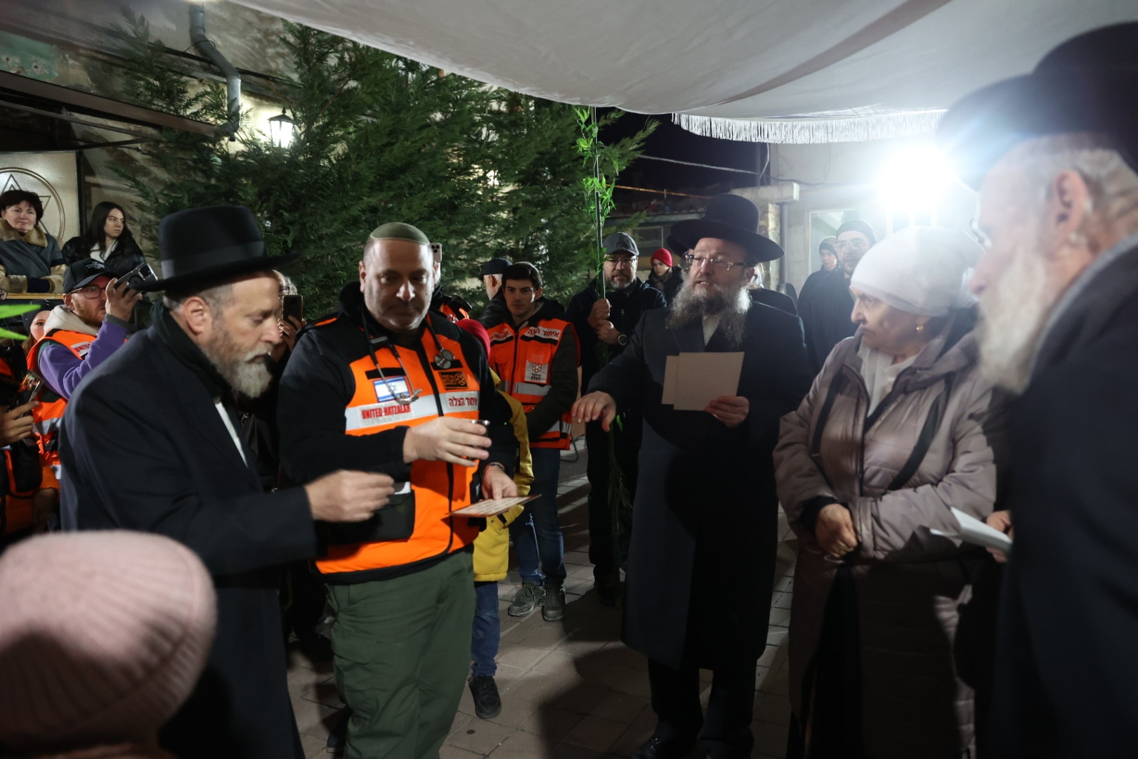 Dr. Zev Neuwirth from Miami reciting one of the blessings during the double wedding of refugees in Kishinev 1