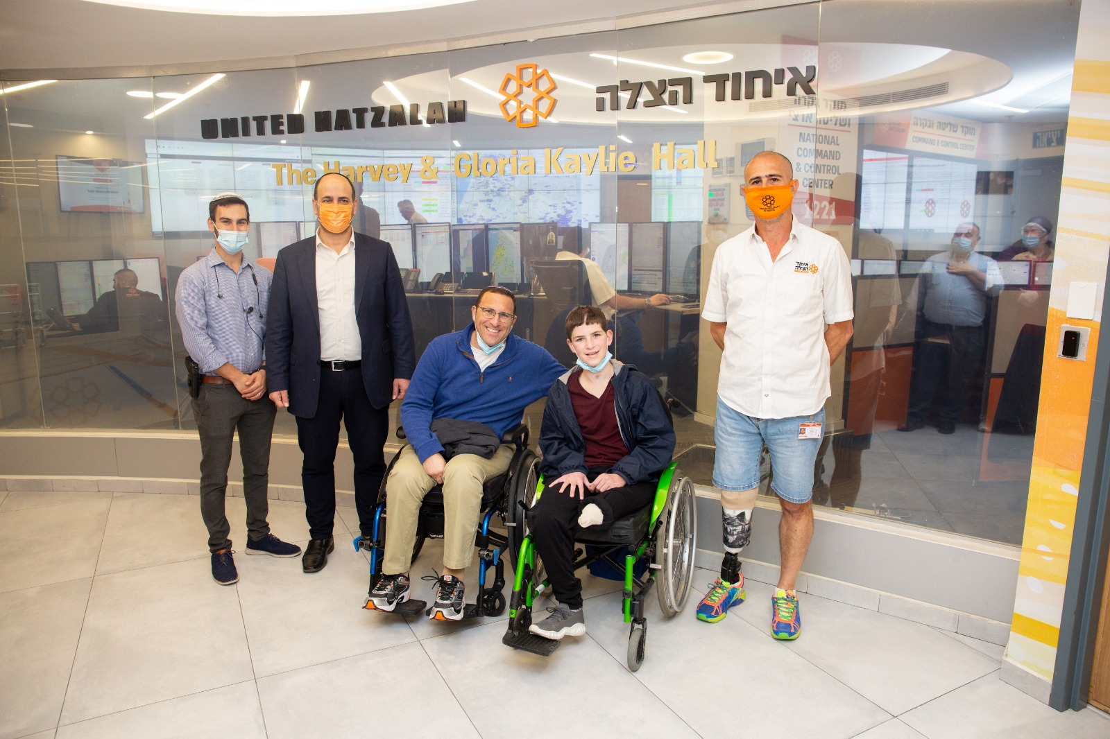 Etai and Ephraim center Eli Almoznino right CEO of UH Eli Pollack and UH volunteer Yonaton Atkin left