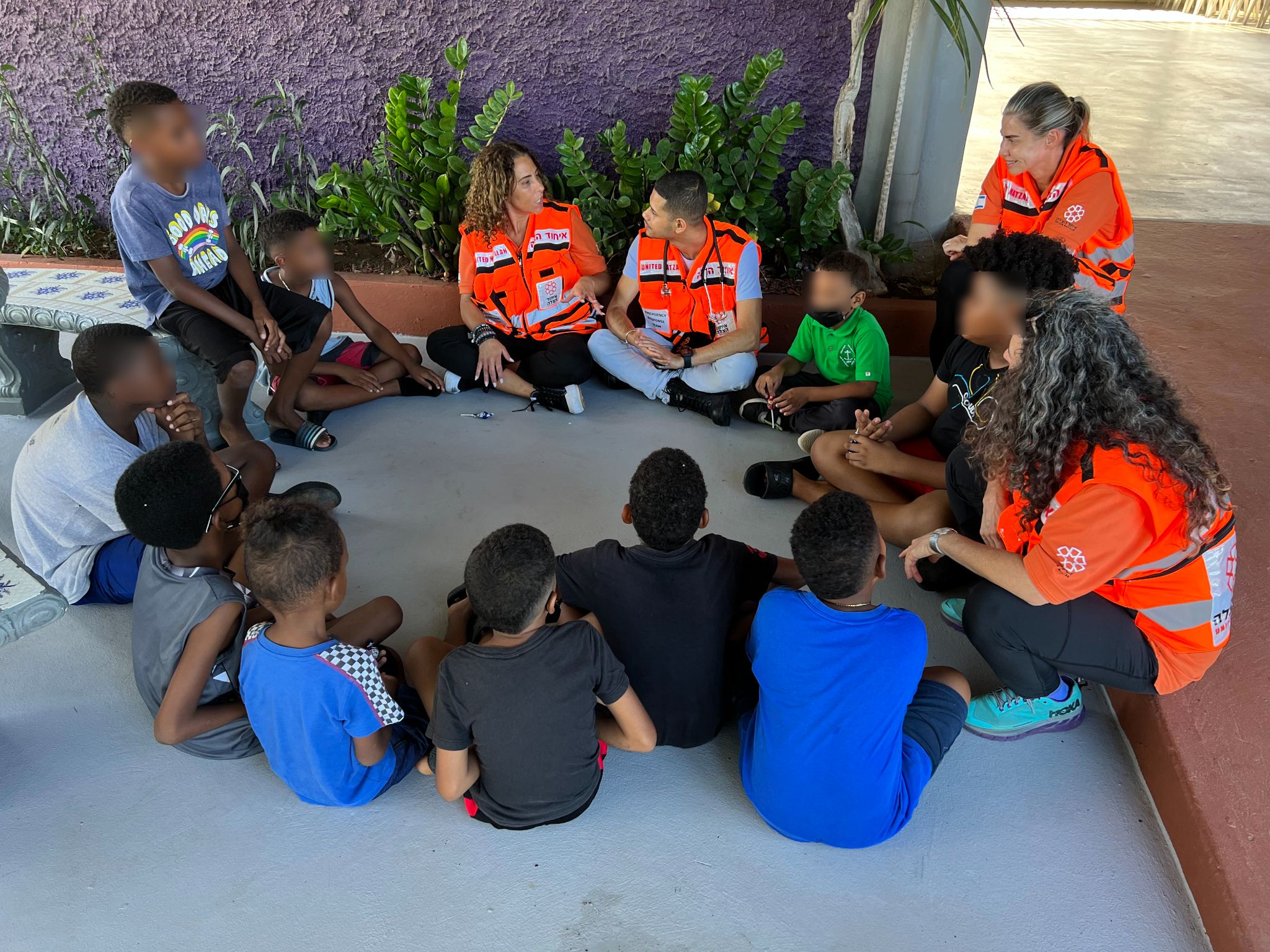 Gaby Luis Kamila Forkosh Lavan and Tamar Schlesinger working with a group of children 1