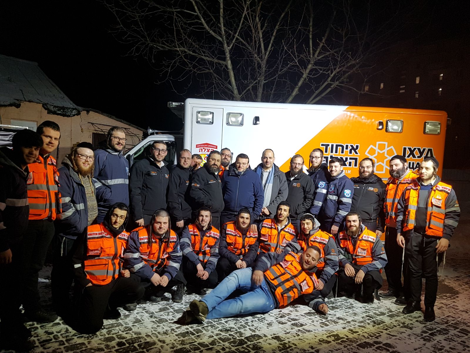 New graduates in Uman in front of new ambulance