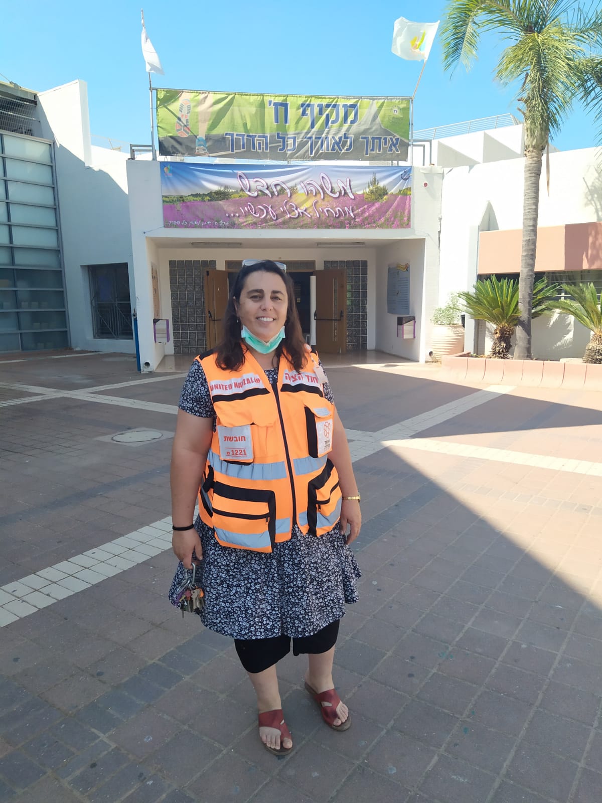 Osnat Reuven standing outside of the school she teaches in 1
