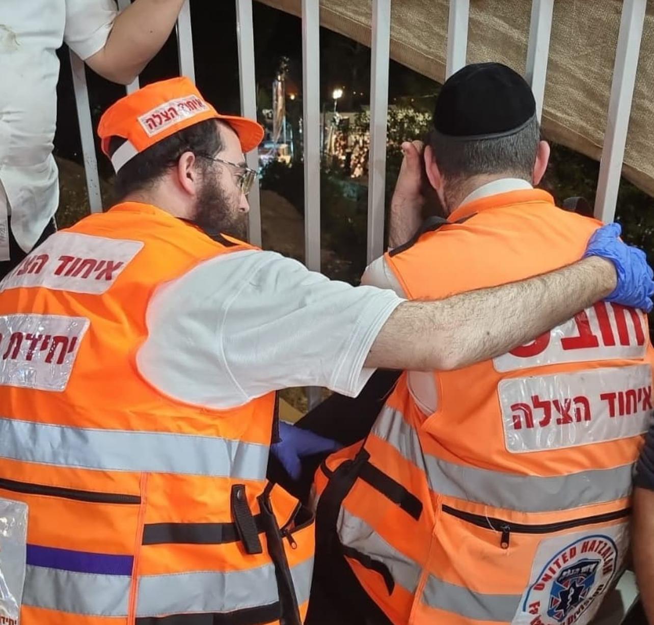 Psychotrauma and crisis response unit volunteer comforting a distraught EMT after the incident