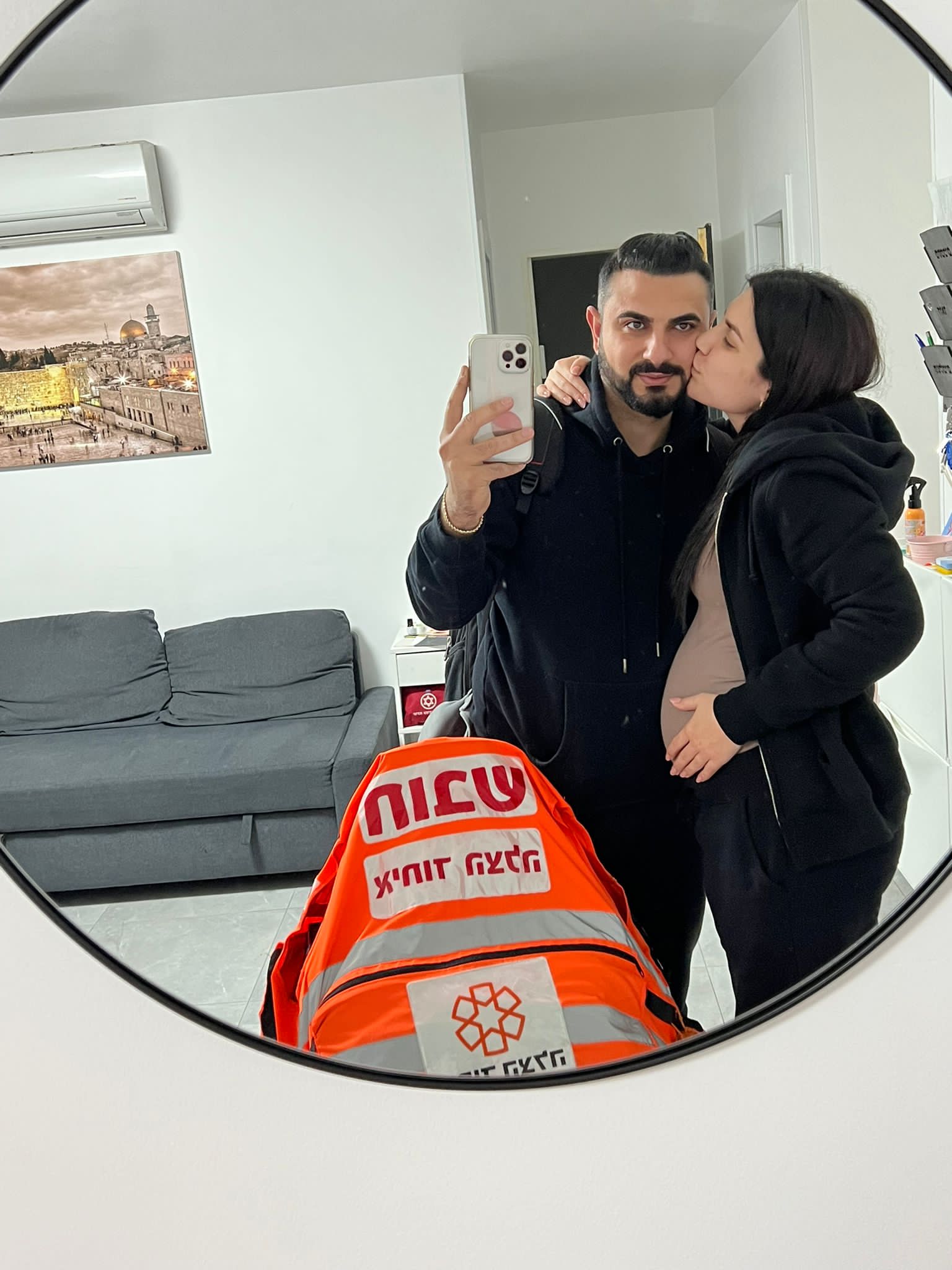Reuven saying goodbye to his wife Noa before the flight