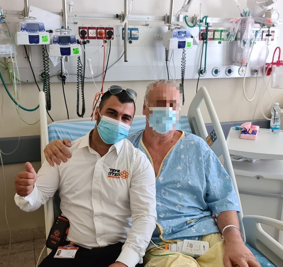 Sasson with the man he saved
