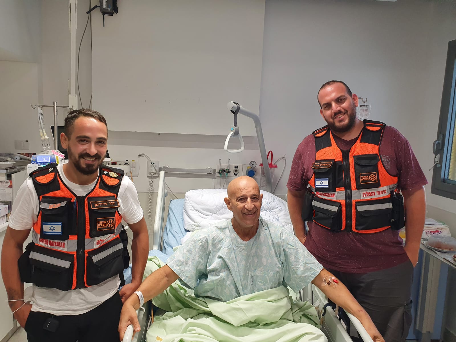 Tal and Dor visiting with the man they saved. 1