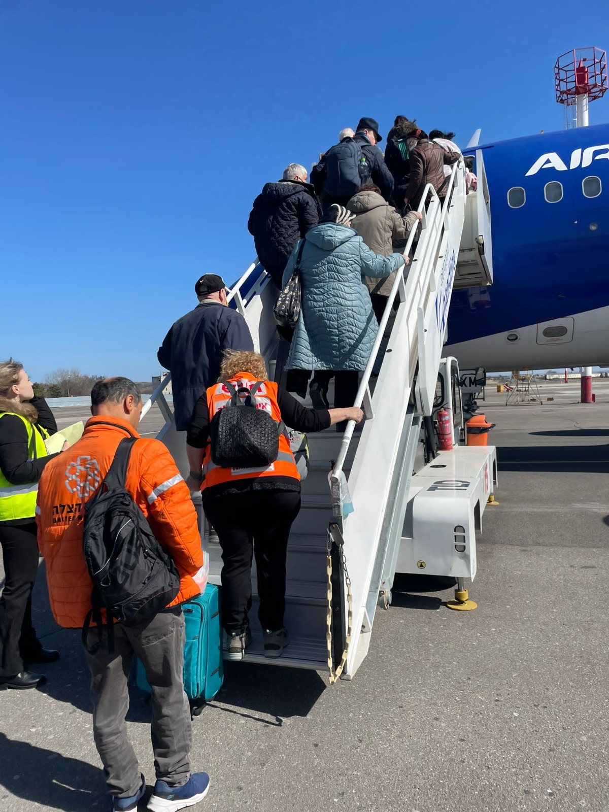 Ukrainian refugees being flown to Israel by United Hatzalah as part of Operation Orange Wings thanks to Adelson familys donation 1 1