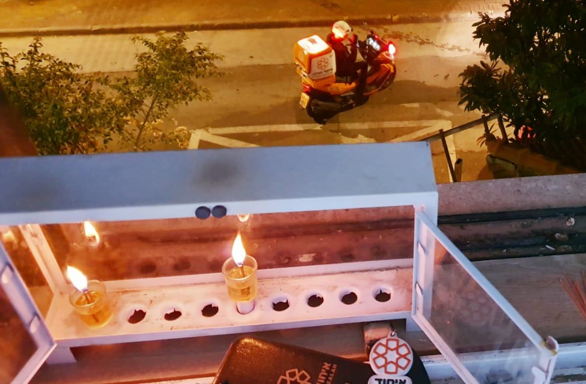 United Hatzalah EMT dispatched to a medical emergency shortly after lighting the Menorah
