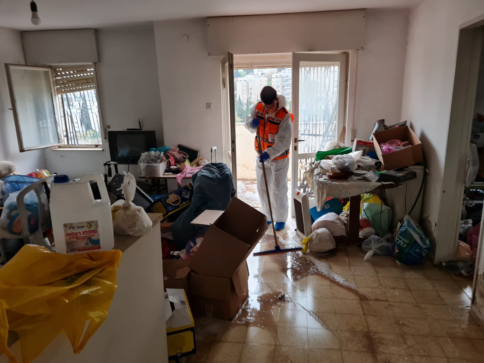 Yehuda cleaning the mans salon 2