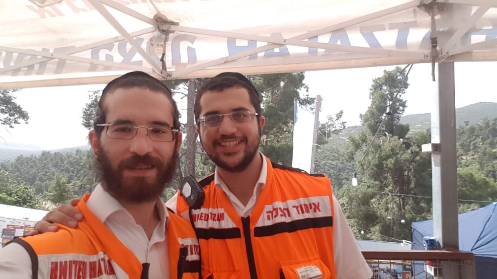 Yitzchak together with another volunteer