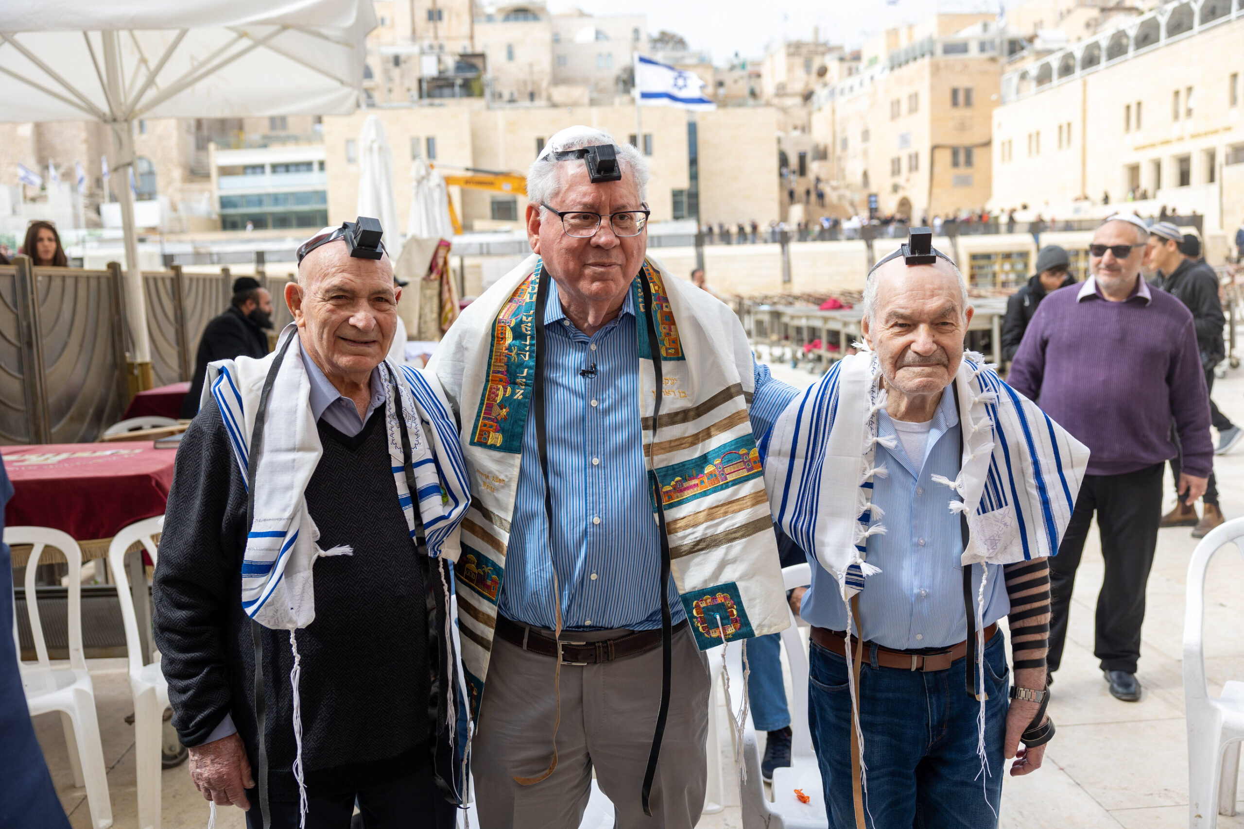 george center together with oscar and walter at their family reunion at the western wall scaled 2