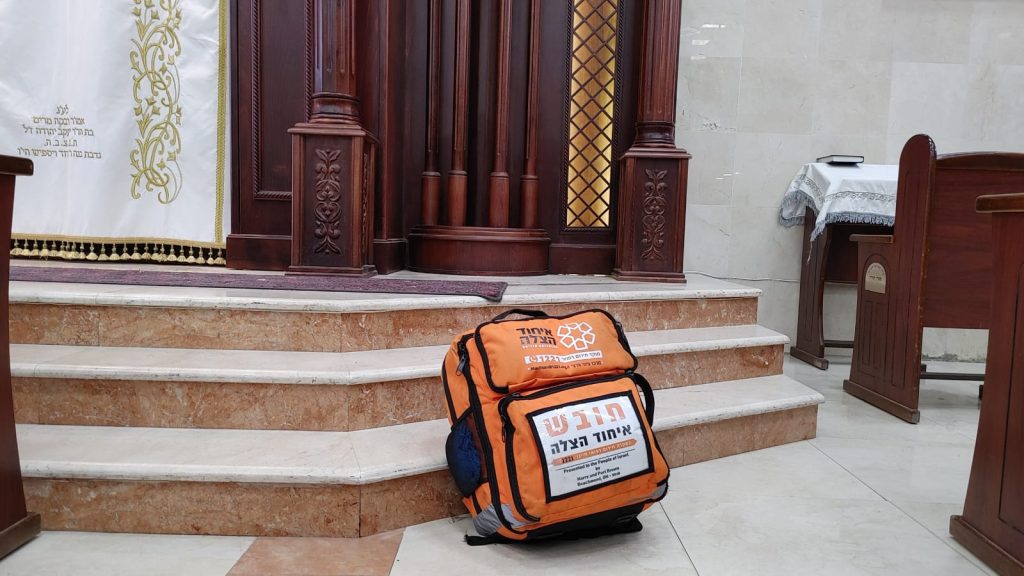 A United Hatzalah medical bag in a shul Illustration 1024x576 1