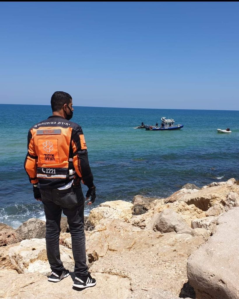 A UH volunteer stands at the beach after a water rescue illustration 820x1024 1