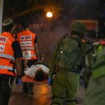 2233649942United Hatzalah volunteers working together with IDF soldiers to treat the simulated wounded censored 696x464