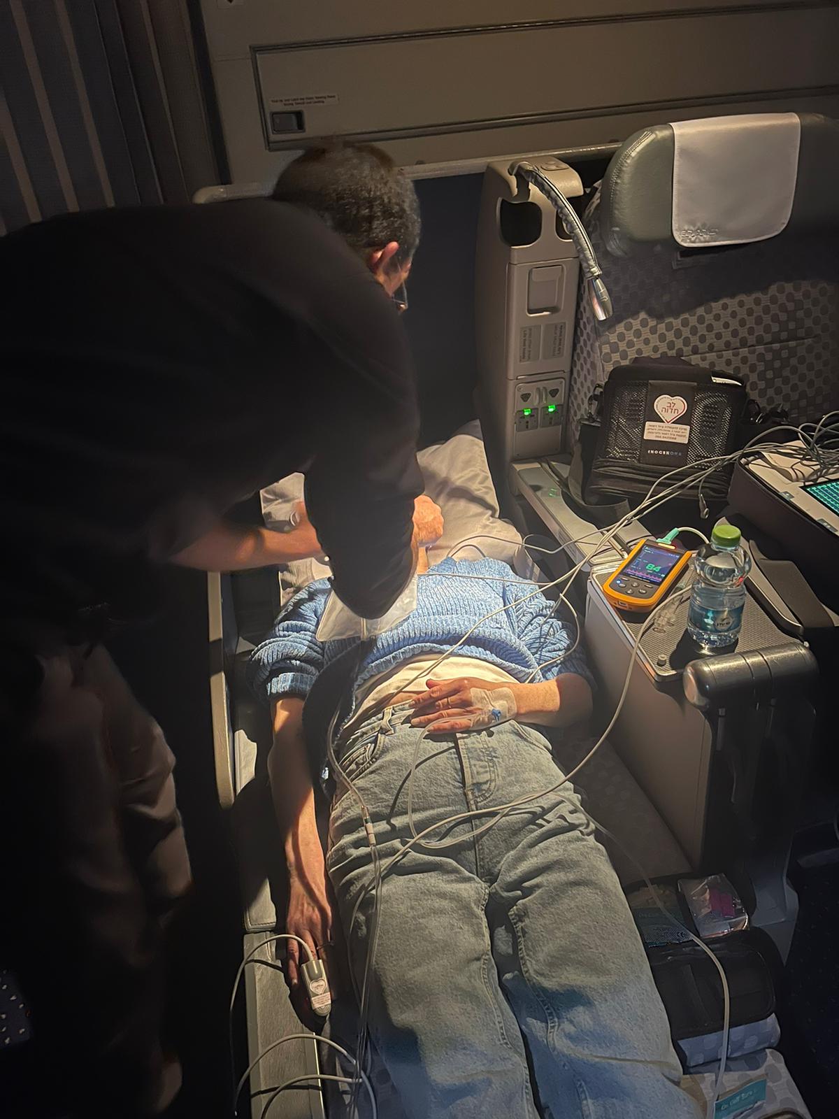 Dr. Ungar treating the passenger