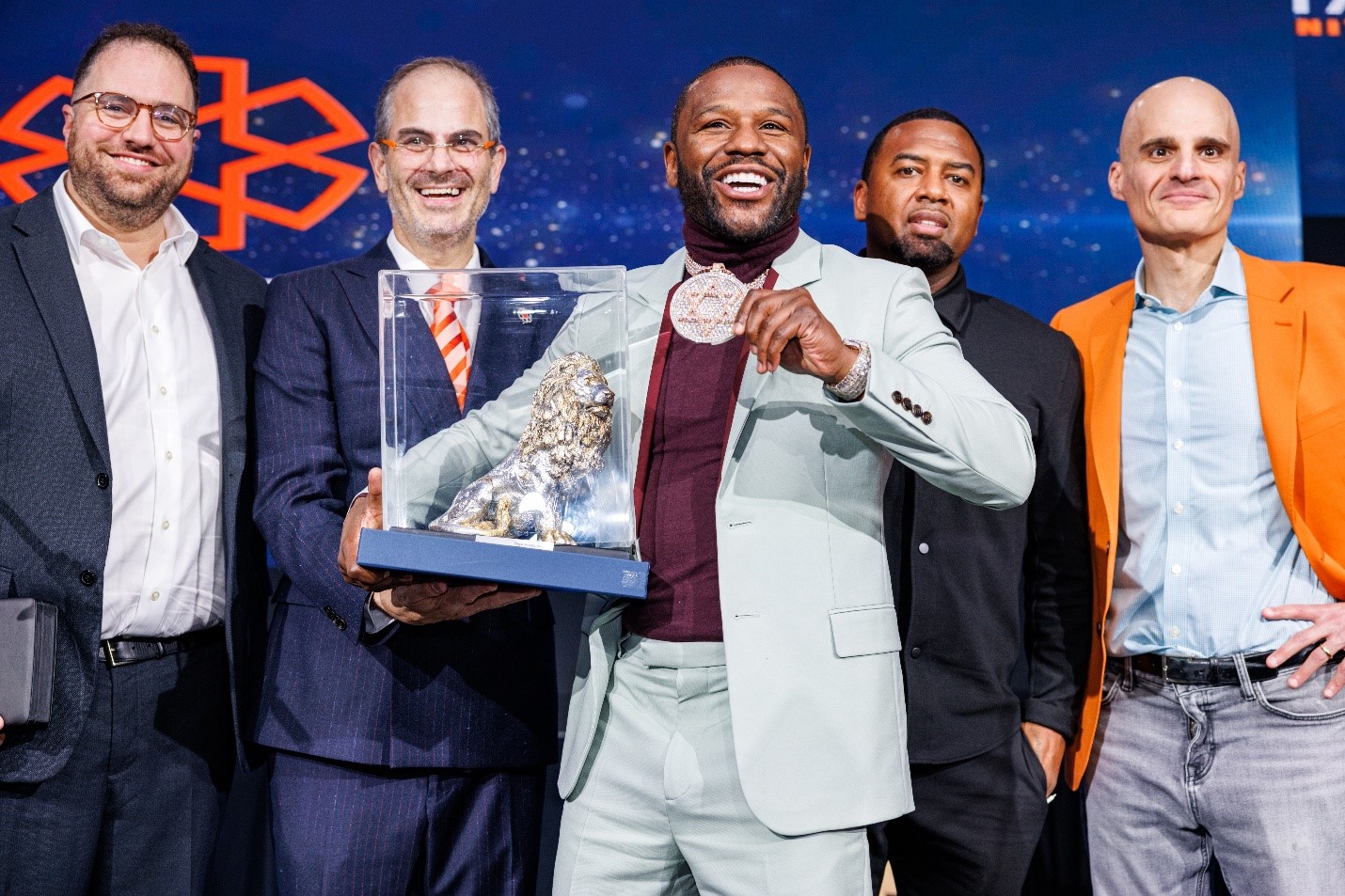 Floyd Mayweather receiving the United Hatzalah Champion of Israel award with Eli Beer and Mark Gerson